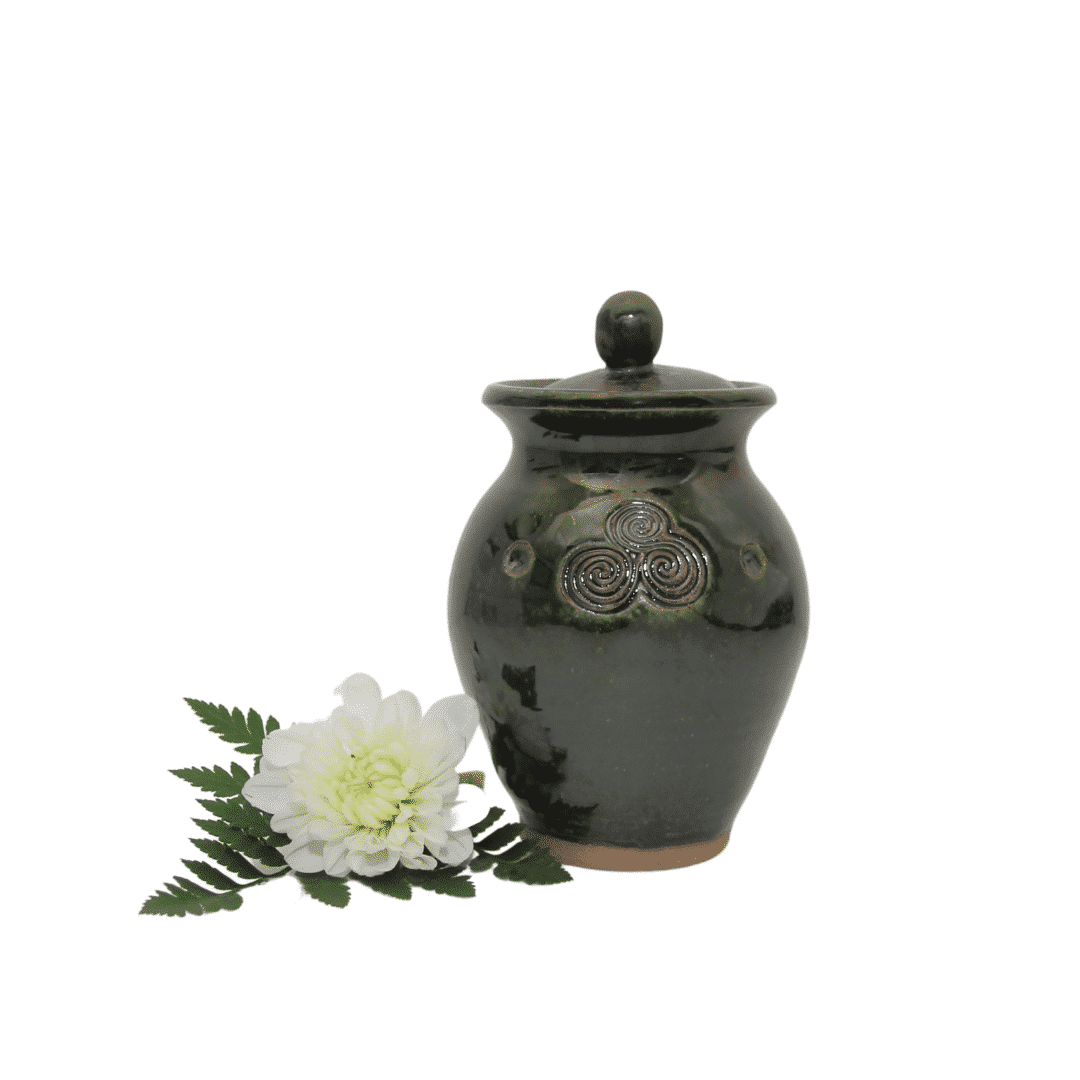 urn with a white flower