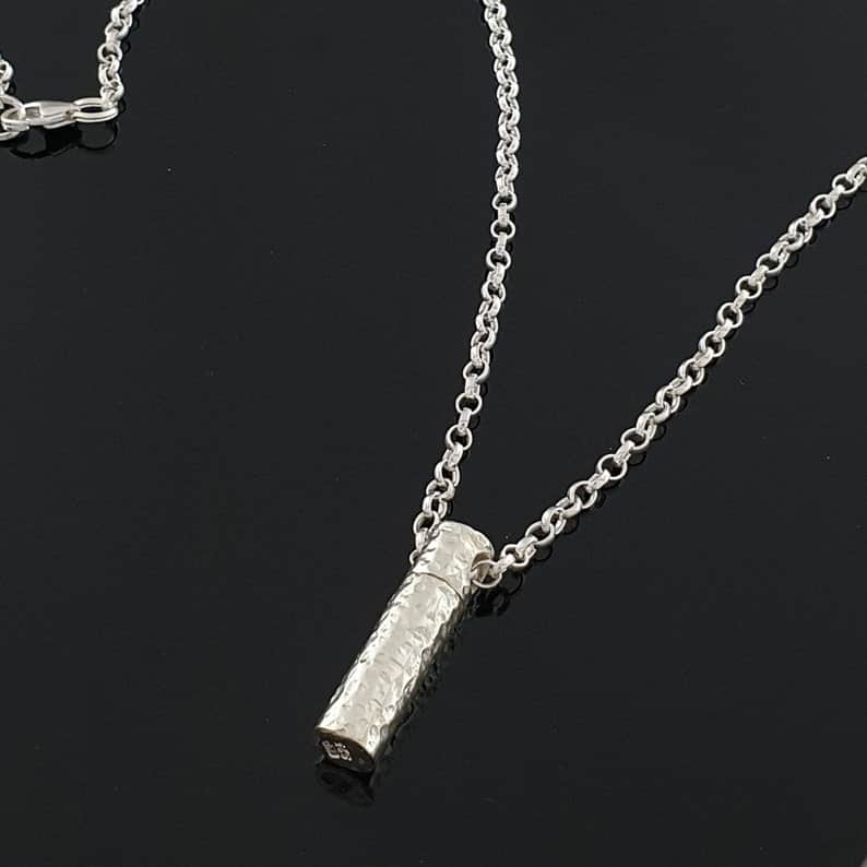 Cucullan hammered silver keepsake necklace from irish irns on black background