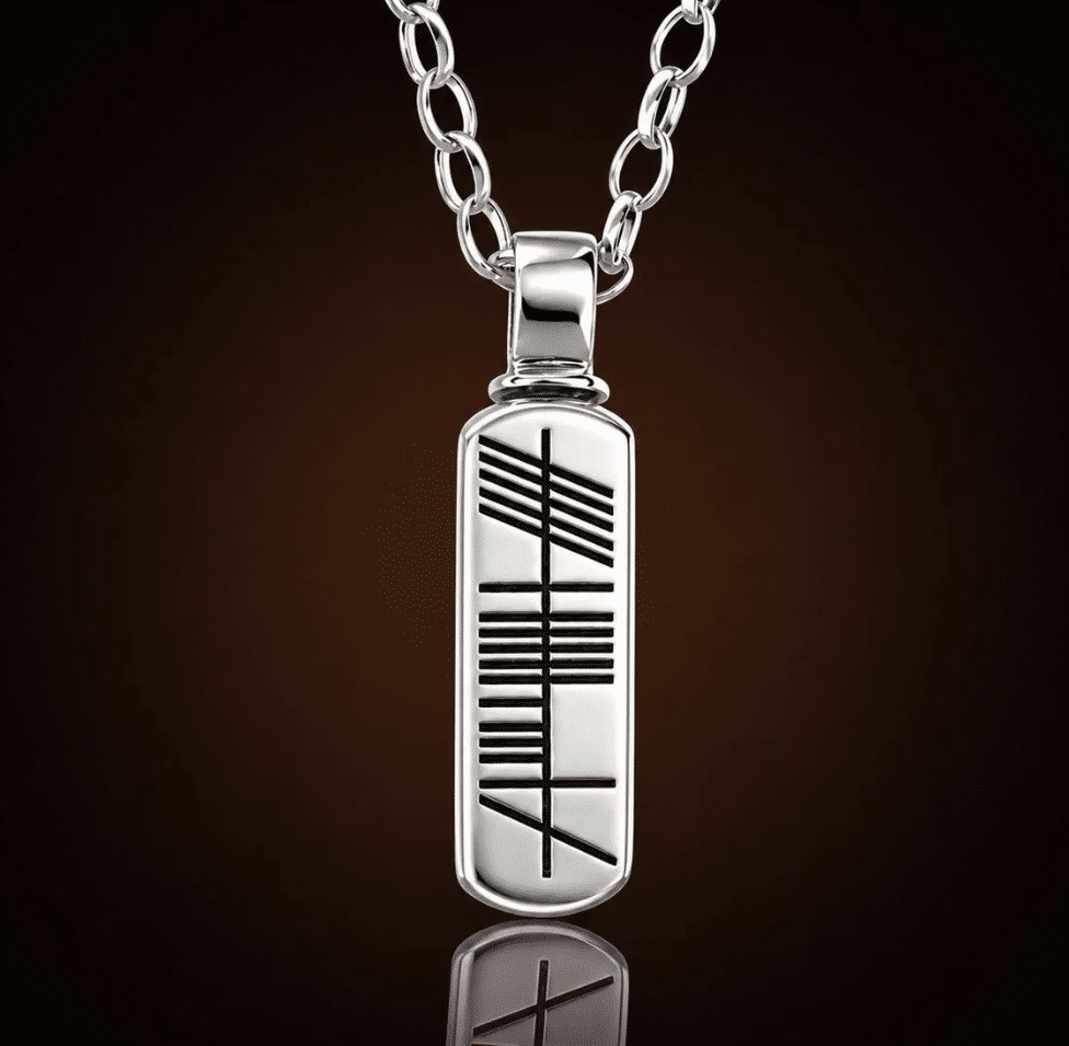 Standing stone pendant with ogham inscription in silver from irish urns